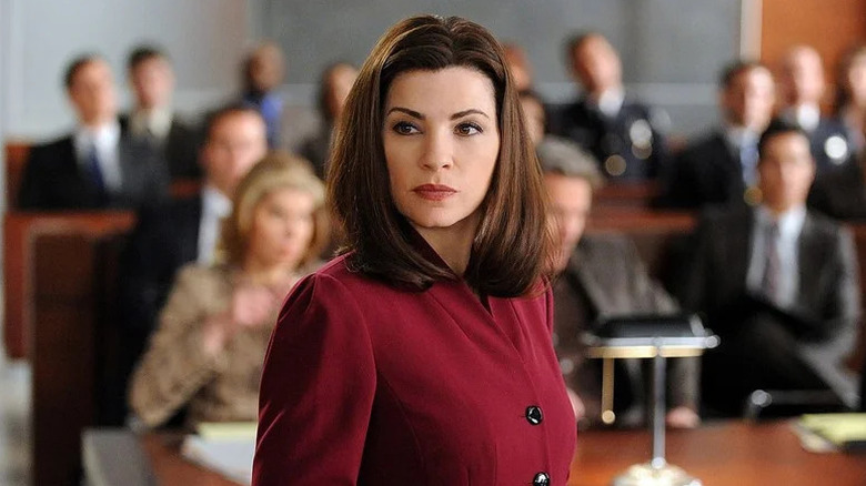 Julianna Margulies as Alicia Florrick standing in courtroom in red in The Good Wife