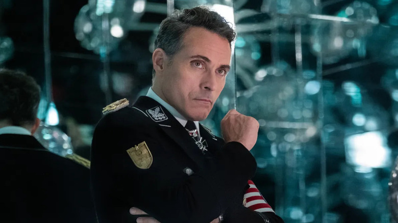 Rufus Sewell as John Smith, considering something in The Man in the High Castle.