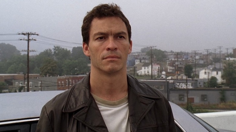 Jimmy McNulty stands overlooking the city by his car