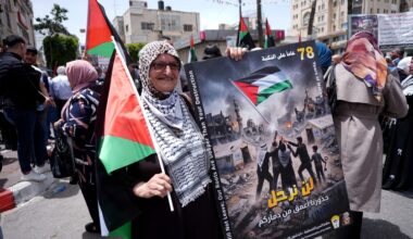 Palestinians march carrying flags and symbolic keys representing the right of return during a demonstration marking the 78th anniversary of the Nakba in Ramallah, West Bank, Palestine, on May 12, 2026.