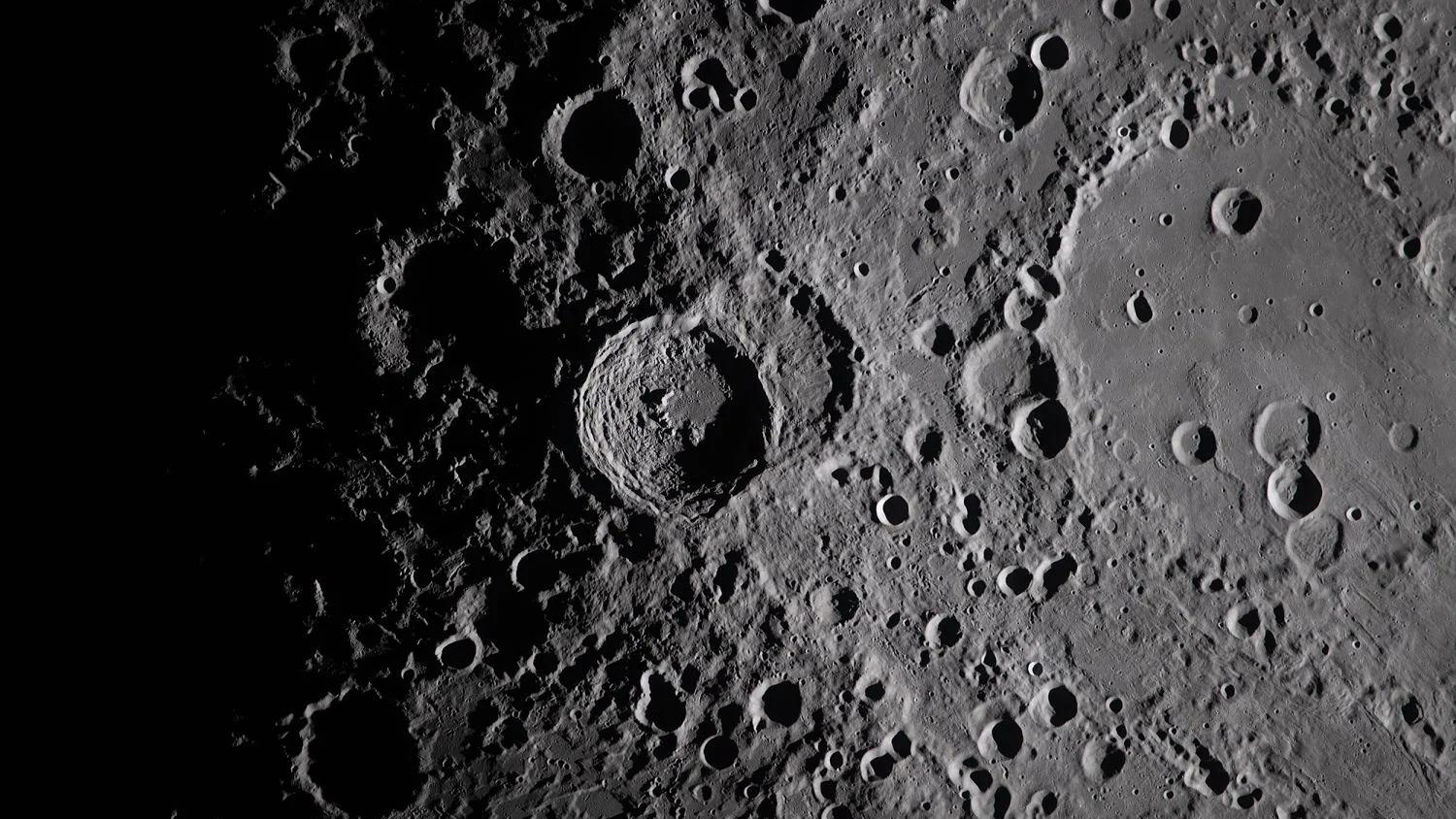 closeup view of the moon's cratered surface