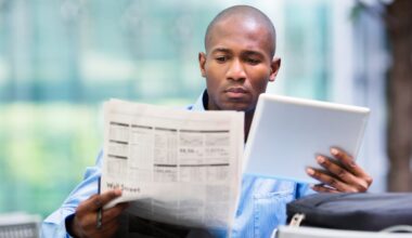 An investor is reading a financial newspaper.