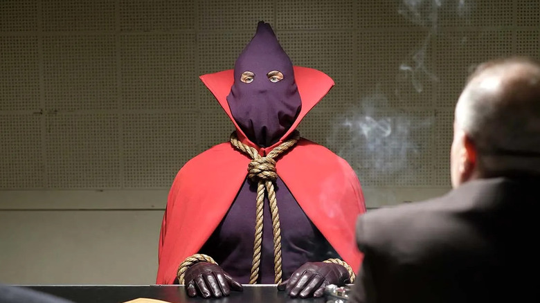 Hooded Justice sits before interrogators in HBO's Watchmen.