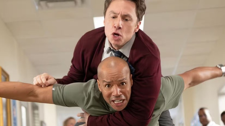 Turk carrying J.D. on his back