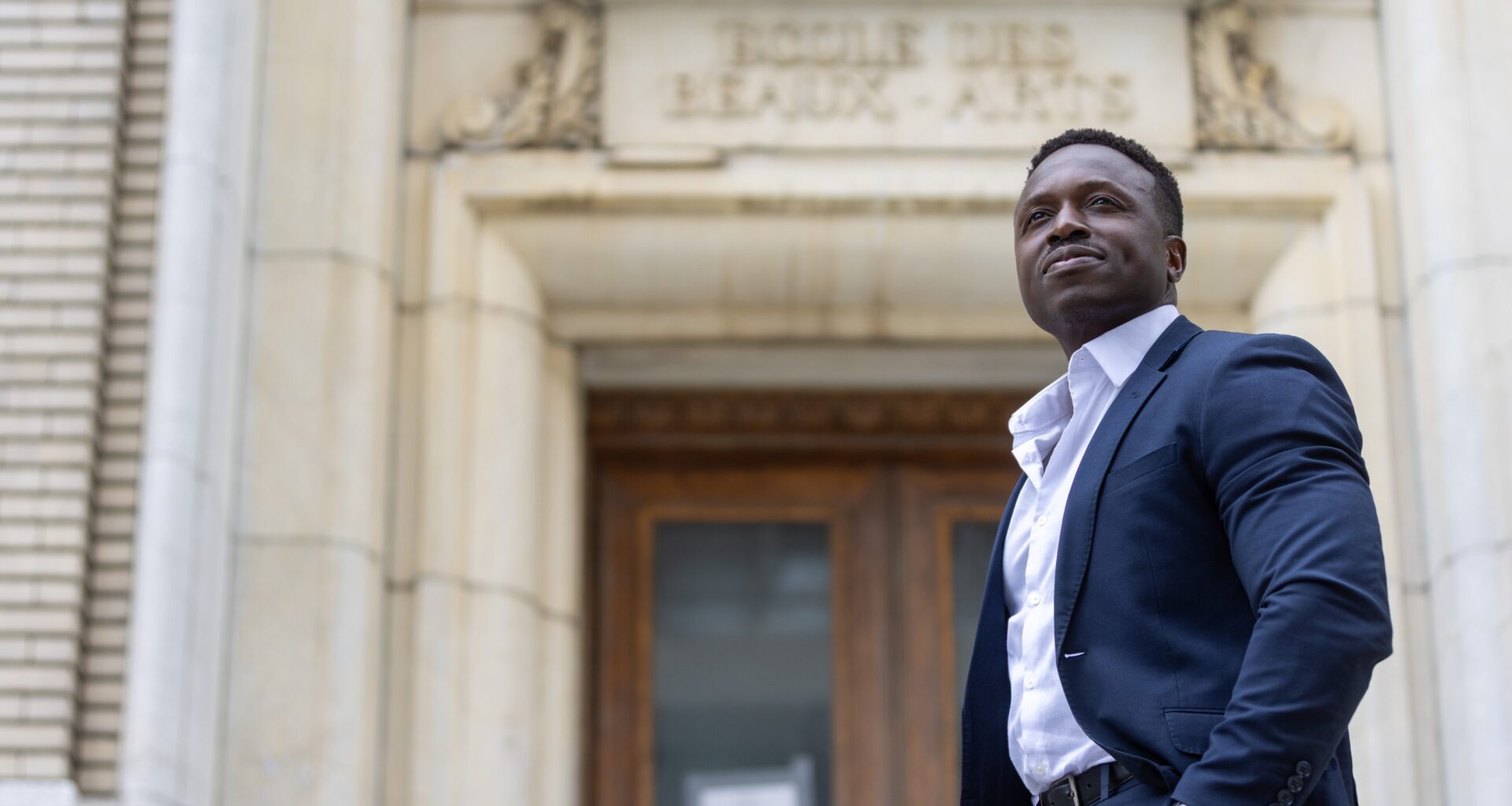 Man stands on step of building in Montreal.