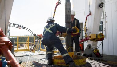Employees torque a pipe at a wedge well at Christina Lake, a situ oil production facility half owned by Cenovus Energy Inc. and ConocoPhillips, in Conklin, Alberta, Canada, on Thursday, August 15, 2013.