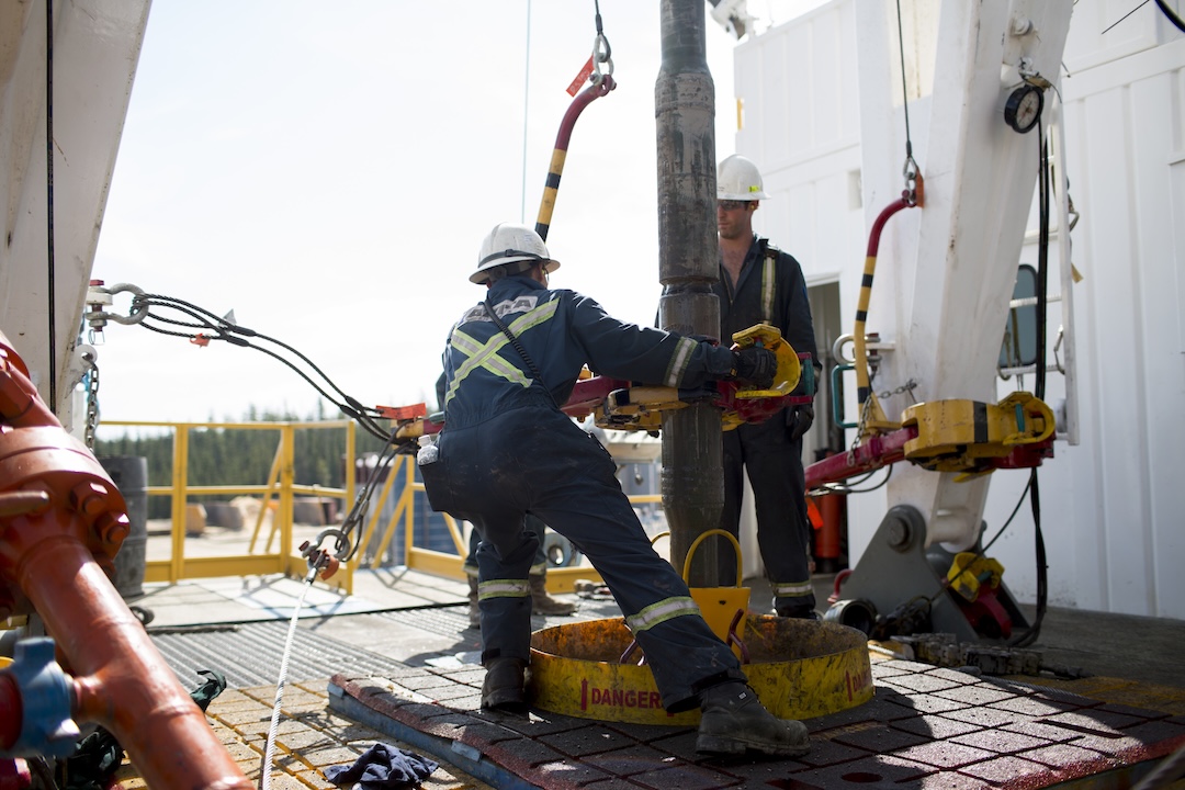 Employees torque a pipe at a wedge well at Christina Lake, a situ oil production facility half owned by Cenovus Energy Inc. and ConocoPhillips, in Conklin, Alberta, Canada, on Thursday, August 15, 2013.