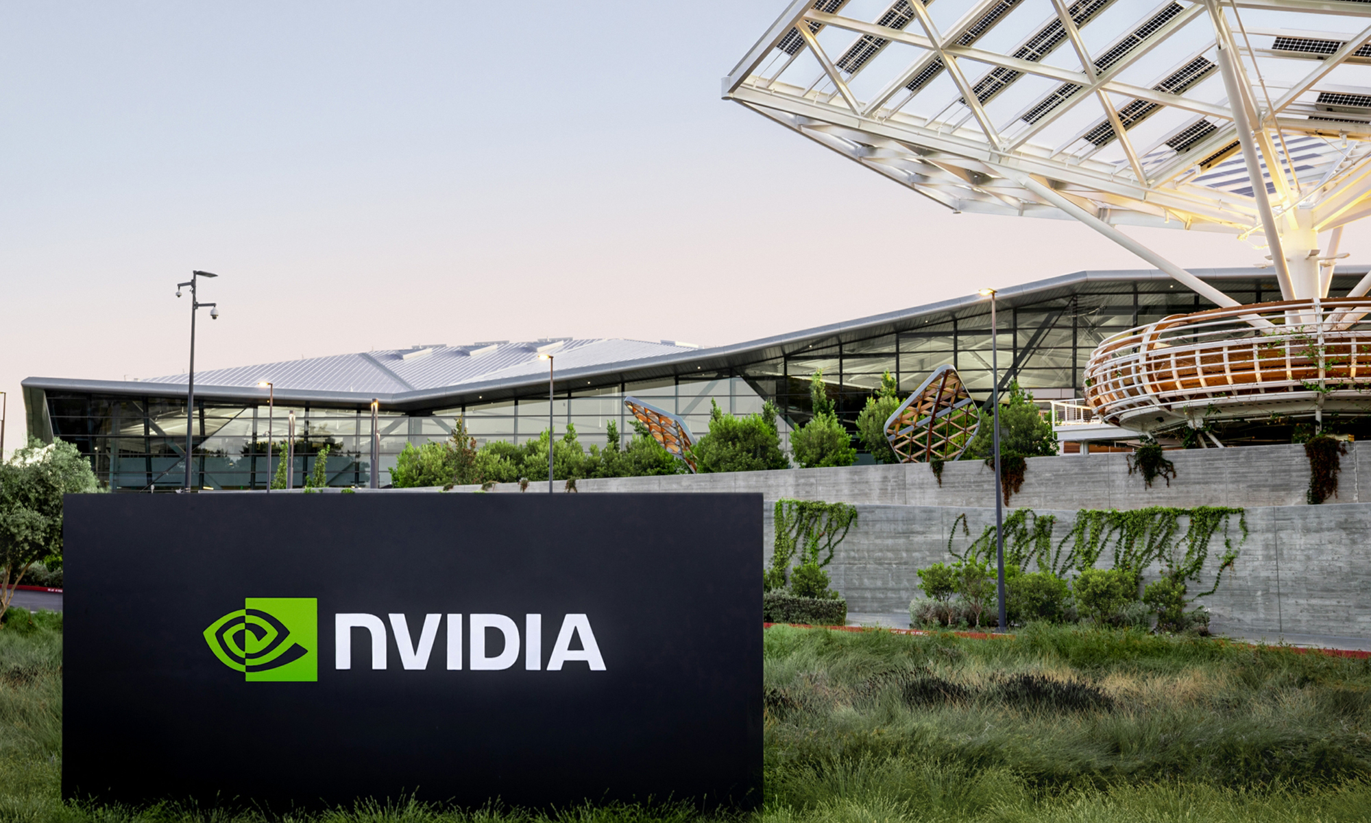 The exterior of Nvidia's headquarters, with a black sign featuring Nvidia's logo in front.