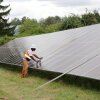 A worker puts the finishing touches on a solar panel in Portland, Oregon.