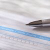 USA, New York, New York City, Close-up of insurance form with pen