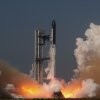 SpaceX's mega-rocket Starship blasts off from Starbase, Texas, on May 22. A plume of white gas extends from the bottom of the rocket, which is vertically taking off from the ground. Large clouds of white gas are on the right and left sides of the frame.