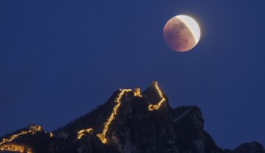Mar. 3, 2026: The moon lights up the night sky over the Simatai Great Wall in Beijing, China during a “blood moon” total lunar eclipse coinciding with the year’s traditional Chinese Lantern Festival.