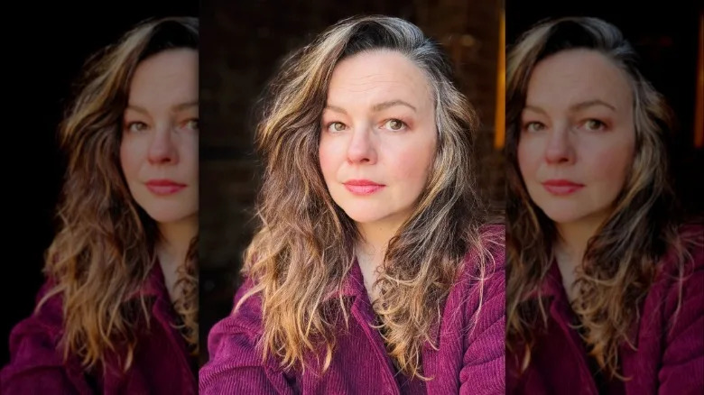Headshot of Amber Tamblyn with graying hair