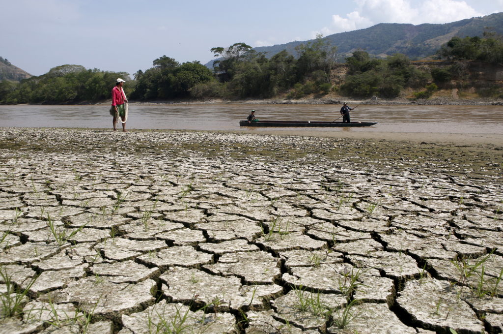Fisherman Gabriel Barreto stands on the shore of the Magdalena river, the longest and most important river in Colombia, in...