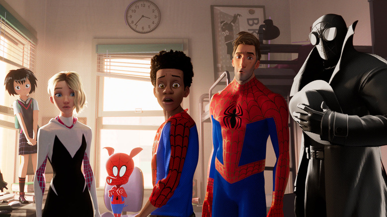 The Spider-Men face the camera in Spider-Man: Into the Spider-Verse.