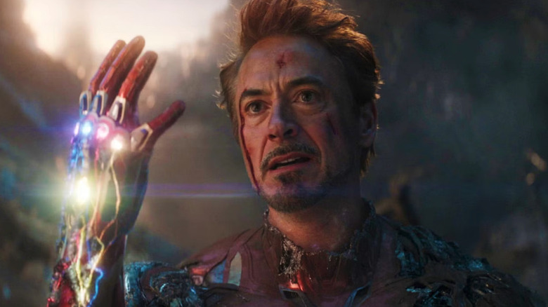 Robert Downey Jr. as Tony Stark holding the Infinity Stones in Avengers: Endgame.