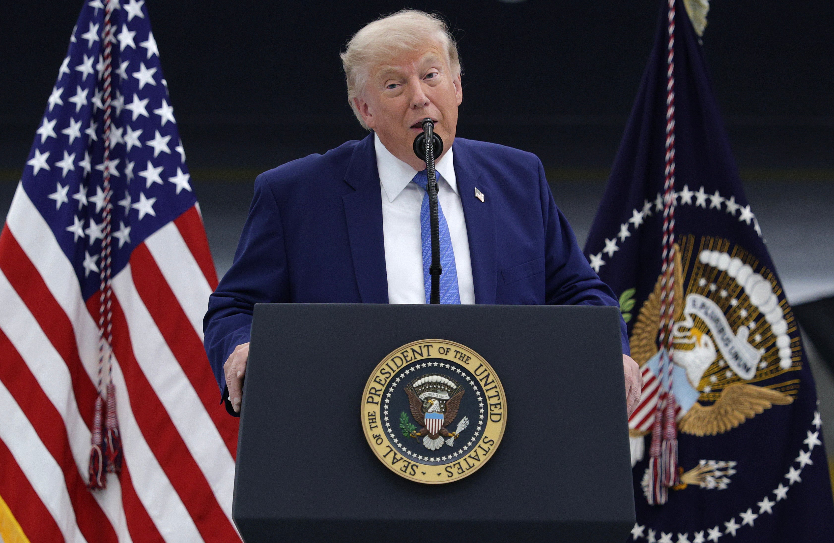 Trump speaks to service members at Joint Base Andrews in Maryland on Friday