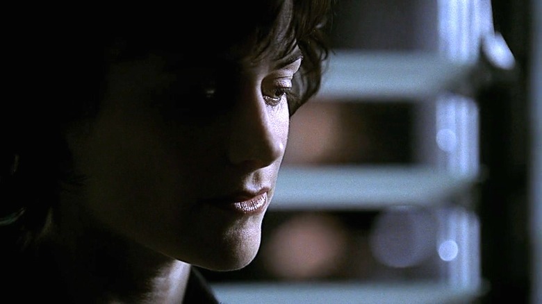Nina Myers, close up, after finishing a phone call