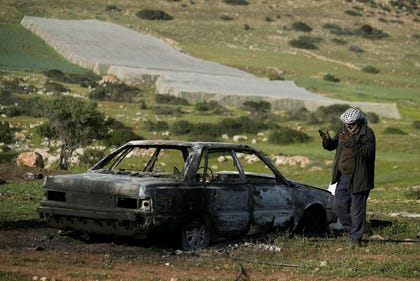 A resident inspects a car that, according to the Palestine Red Crescent, was torched by Israeli settlers in the West Bank village of Tayasir, near Tubas, Tuesday, March. Credit: Majdi Mohammed/AP A resident inspects a car that, according to the Palestine Red Crescent, was torched by Israeli settlers in the West Bank village of Tayasir, near Tubas, Tuesday, March.