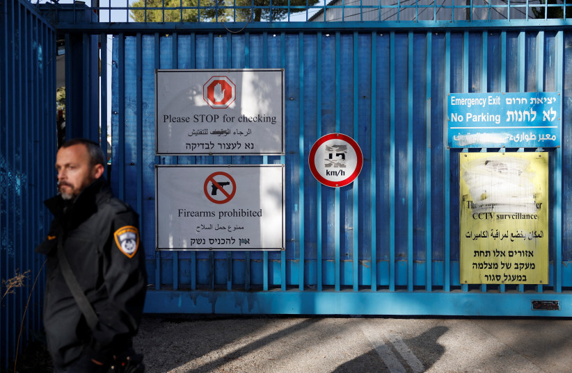 POLICE ARE on the scene as they carry out a raid at UNRWA headquarters in Jerusalem on Monday. UNRWA is rotten to its core, the writer argues.