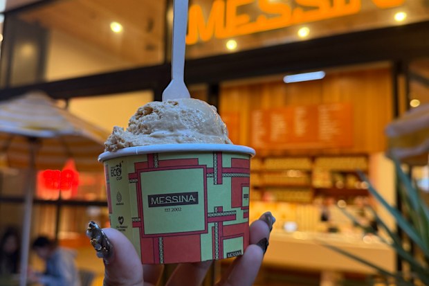 Gelato Messina cream being held up in front of the store