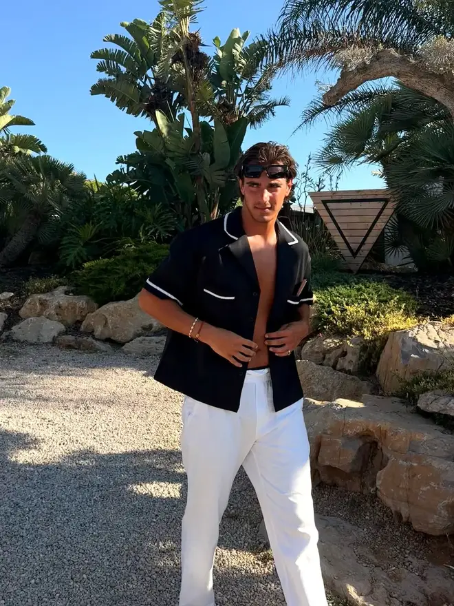 Love Island's Lorenzo pictured posing on holiday.