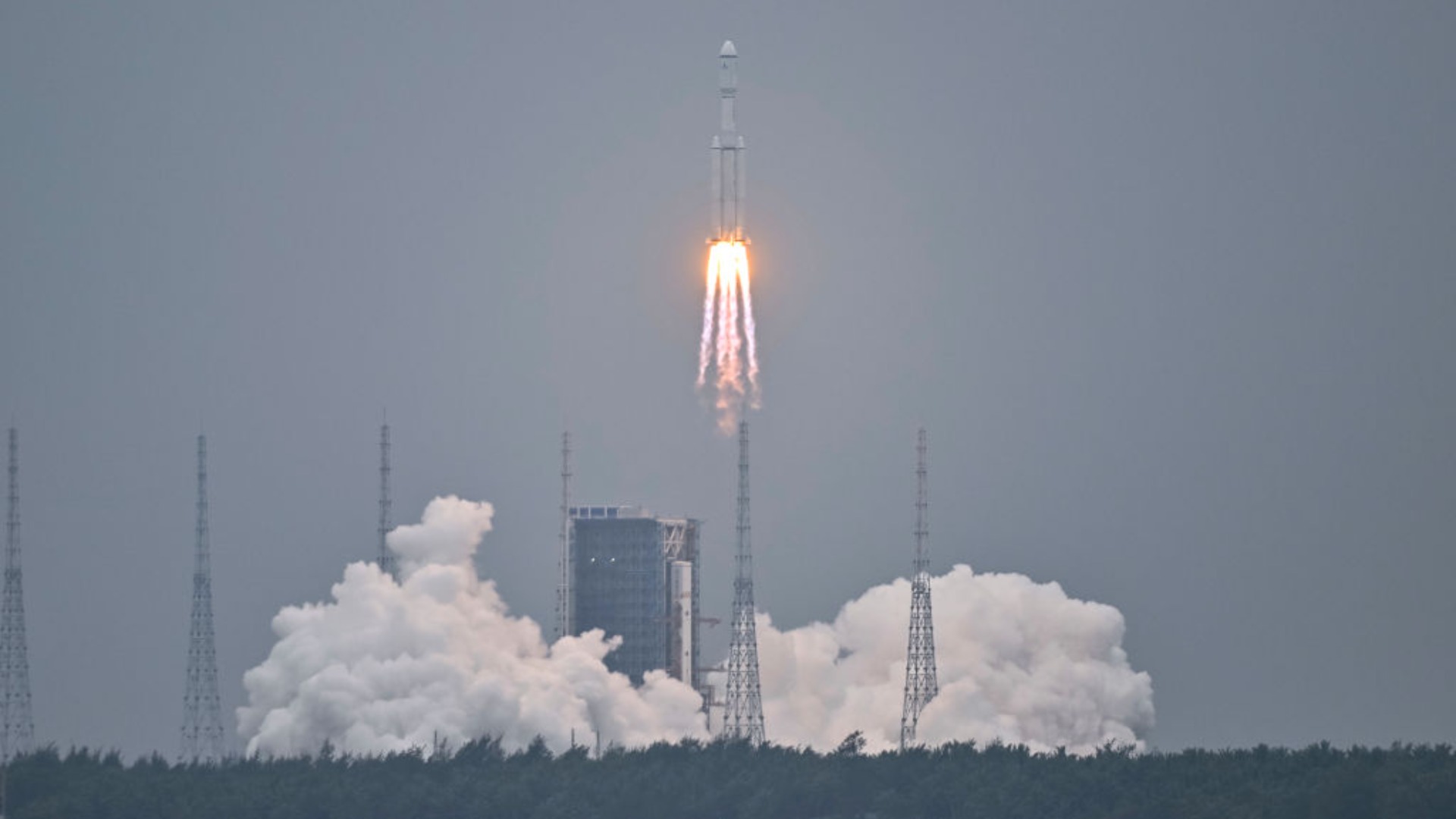 A photo of a rocket blasting upward.