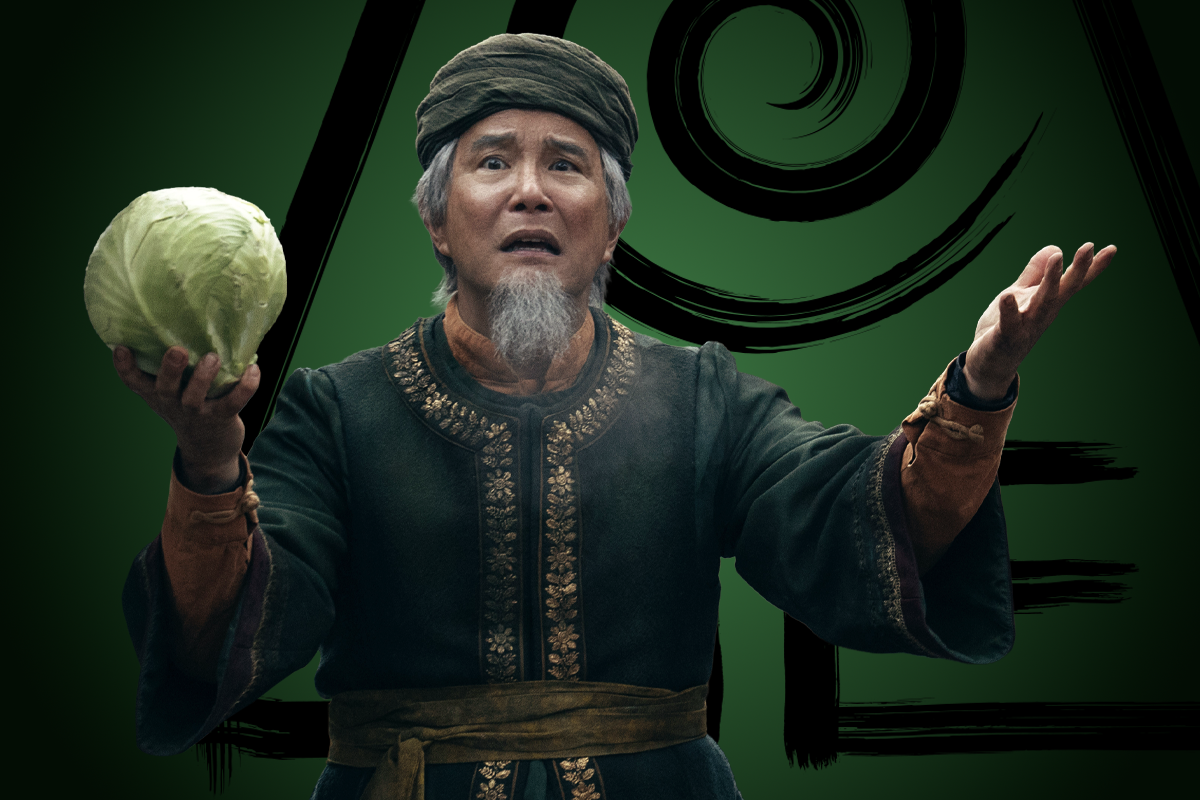 James Sie as Cabbage Man in traditional attire holds a cabbage with an expressive face. He stands against a dark green backdrop with stylized swirl patterns, suggesting a mystical or cultural setting.