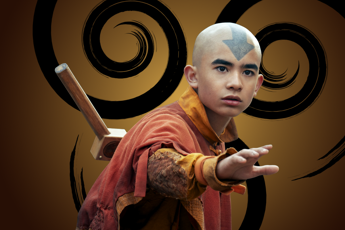 Gordon Cormier as Aang with a blue arrow tattoo on his head, wearing orange robes and carrying a staff, stands in a defensive pose against a backdrop of swirling black patterns on a brown background.