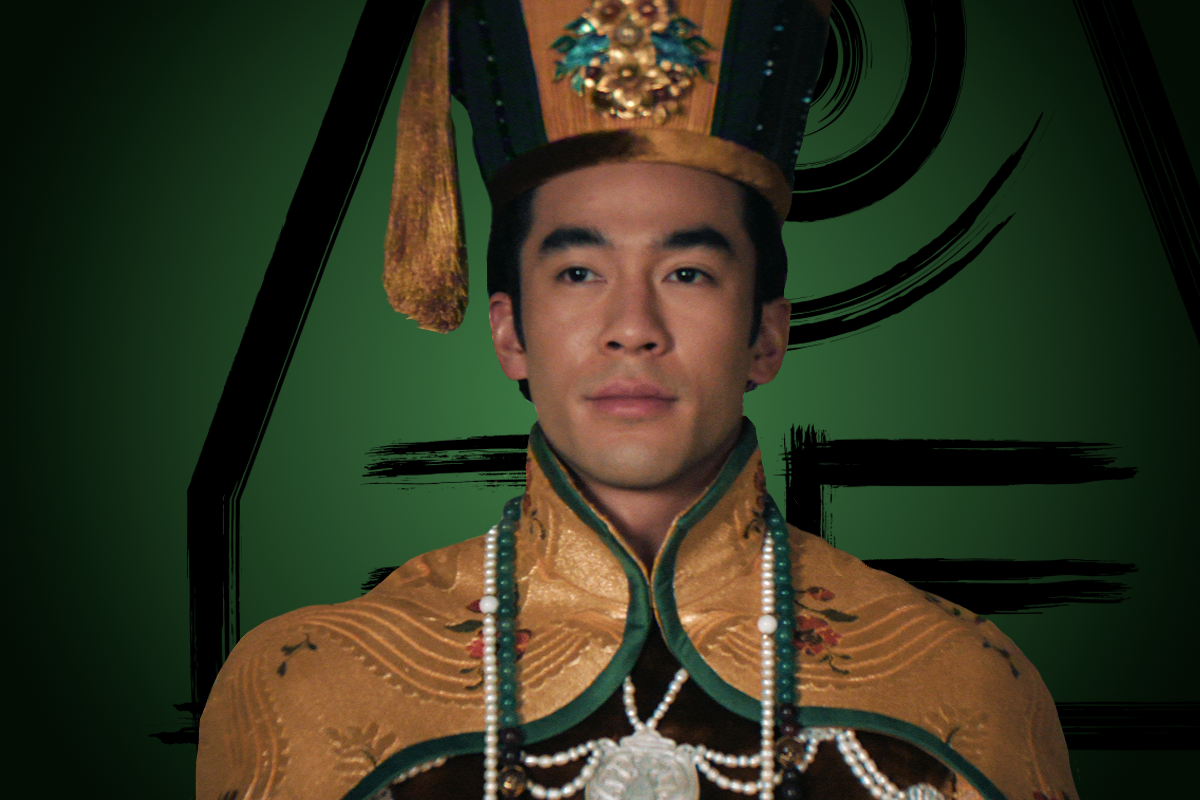 Justin Chien as King Kuei in traditional ornate golden imperial attire with detailed embroidery, a beaded necklace, and a tall decorated headdress, standing against a green background with black geometric and brushstroke patterns.