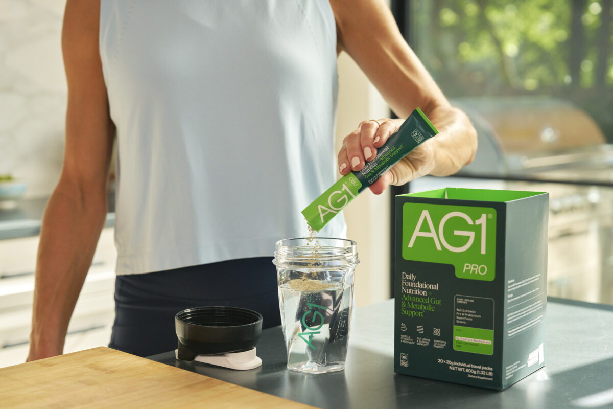 Athletic man using AG1 Pro