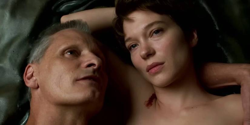 Viggo Mortensen and Lea Seydoux lay in bed in David Cronenberg's 'Crimes of the Future'