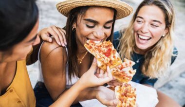 three friends eat pizza