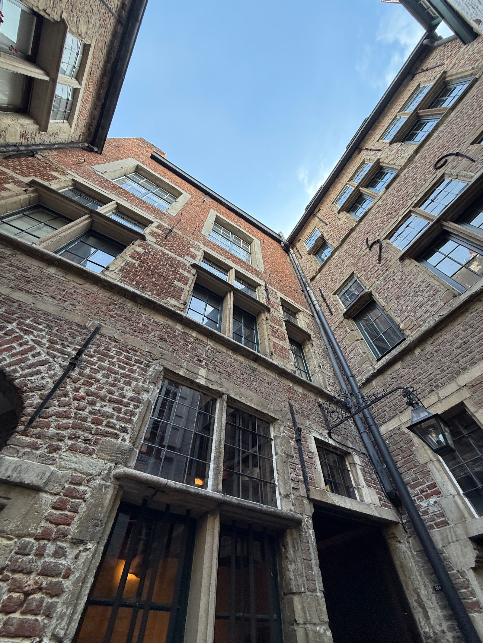 Image may contain City Urban Architecture Building High Rise Apartment Building Home Damage and Window  Broken