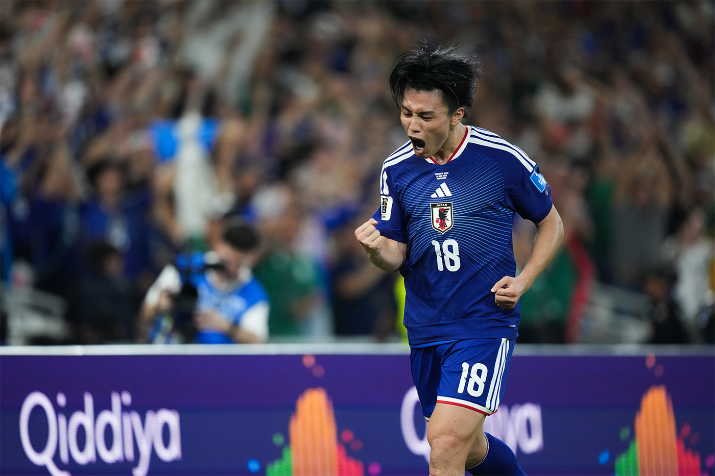 Japan's Ayase Ueda celebrates after scoring against Tunisia in a 2026 FIFA World Cup group stage match at BBVA Stadium in Monterrey, Mexico.