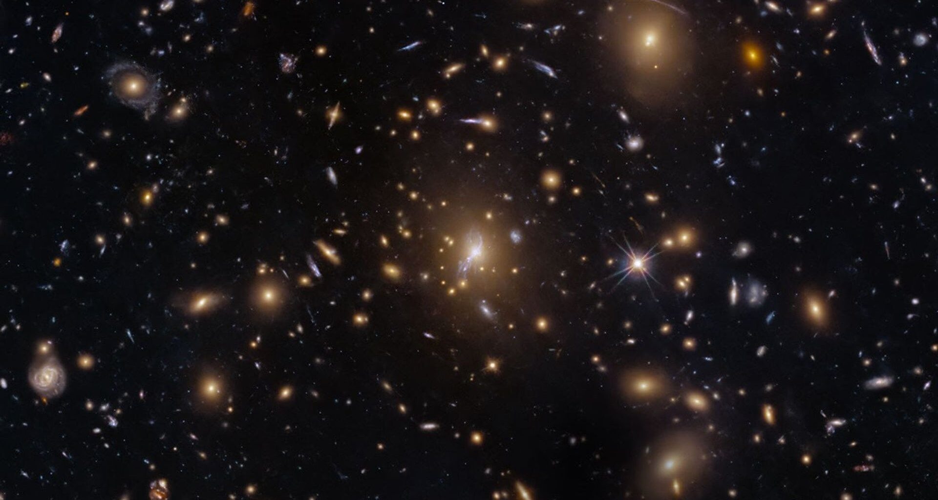 Hubble image of the MAC0329-0211 galaxy cluster. Credit - NASA, ESA, M. Postman (STScI); Image Processing: G. Kober (NASA/Catholic University of America)