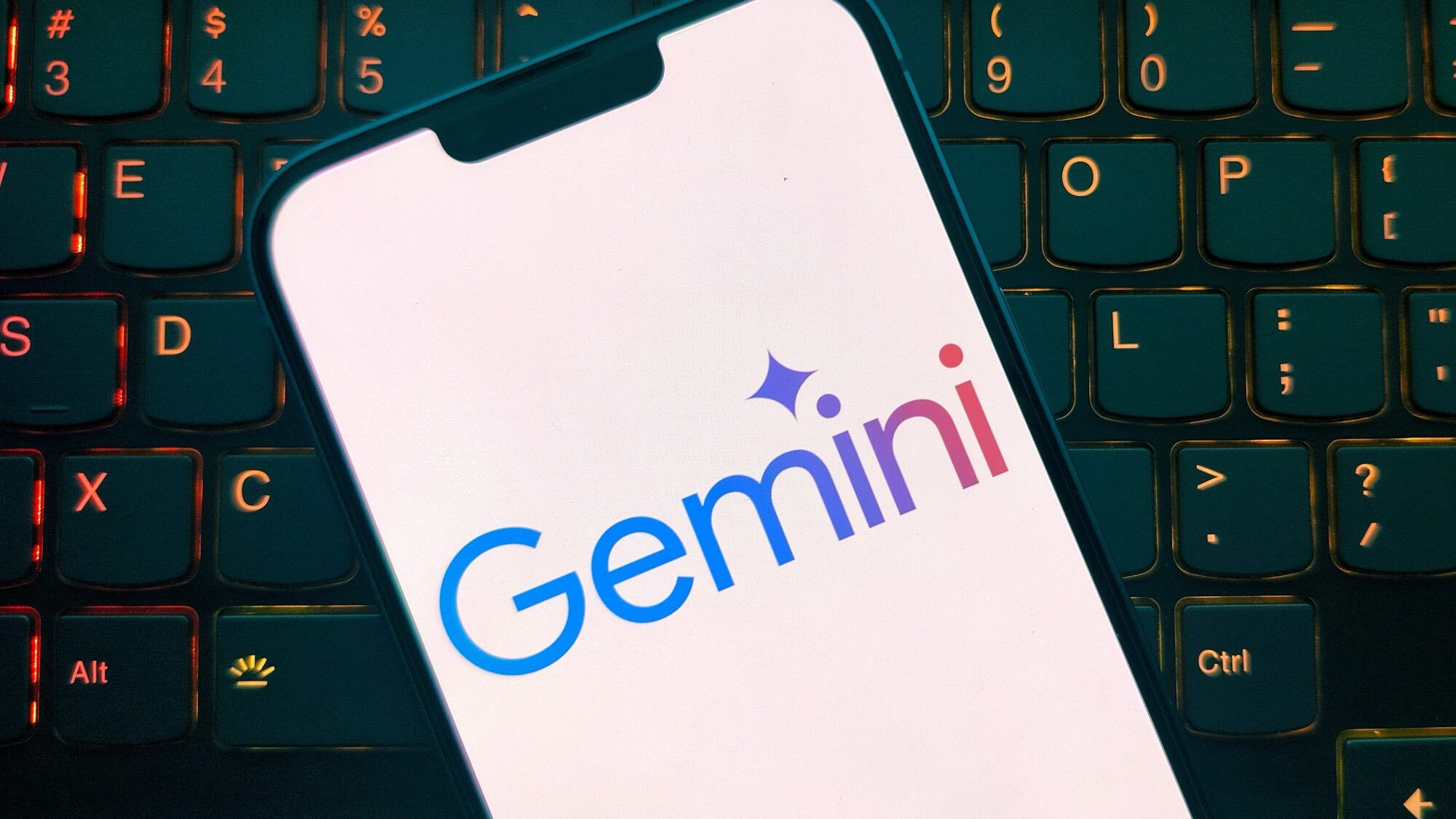 Gemini on a phone screen in front of a keyboard