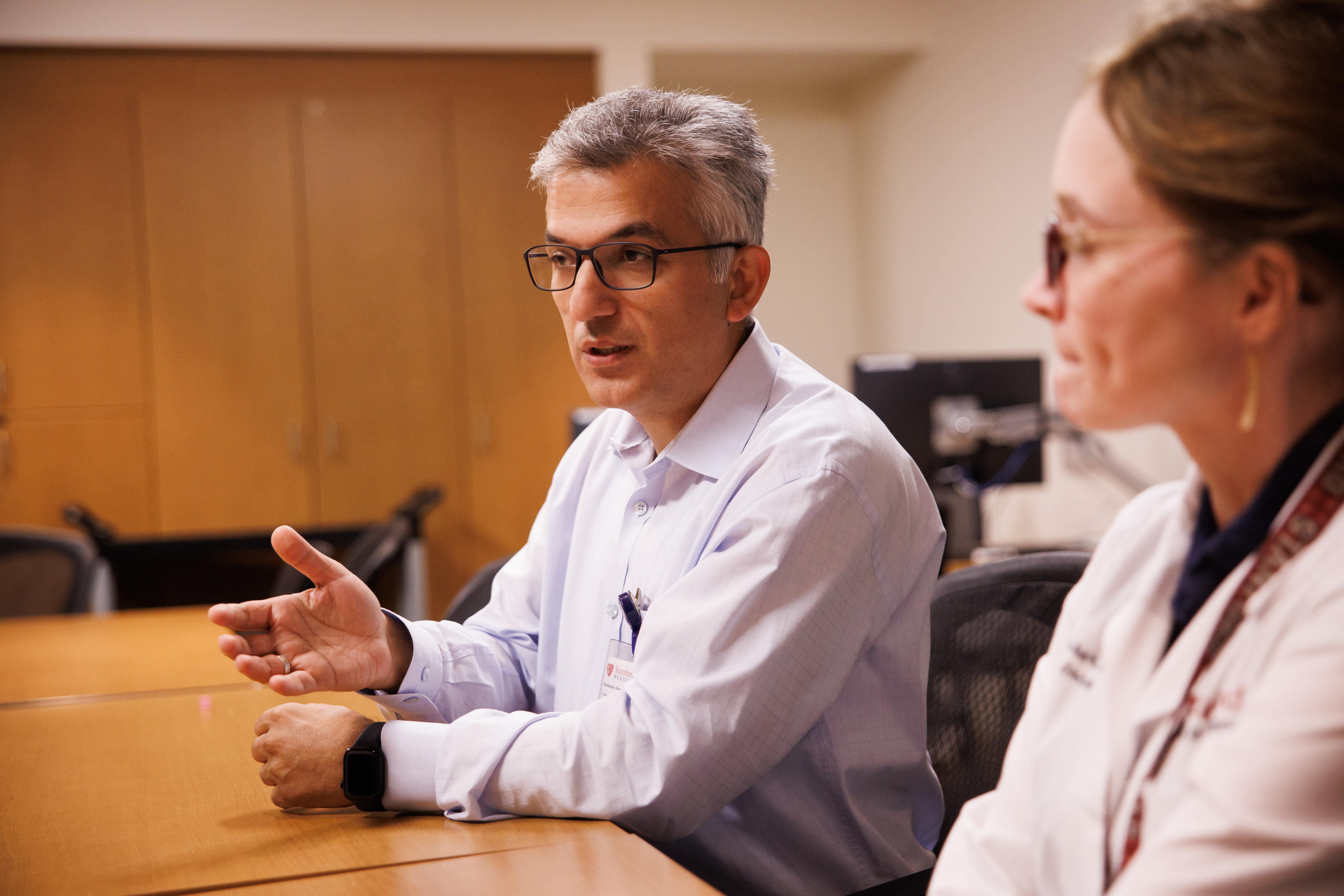 Stanford Medicine medical physicist Murat Surucu talks during an interview...