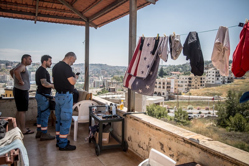 Paramedics watch for Israeli airstrikes from the headquarters of the Nabatieh Ambulance Service, southern Lebanon. Photograph: Sally Hayden