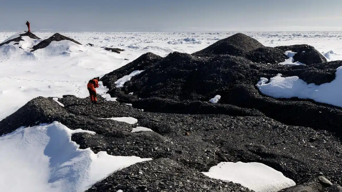 Whoi Biologist Kirstin Meyer Kaiser And Fellow Researchers Examine An Iceberg Covered In Rocky Debris In The Fram Strait, June 2021.