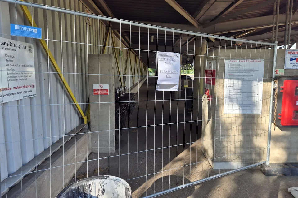 Fencing blocking off the main stand at Harvey Hadden Stadium.