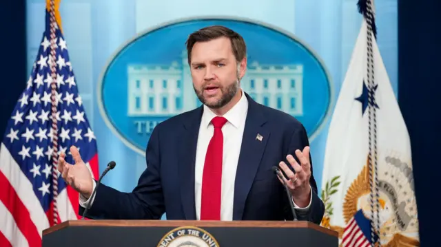 A file photo of Vance speaking at a podium