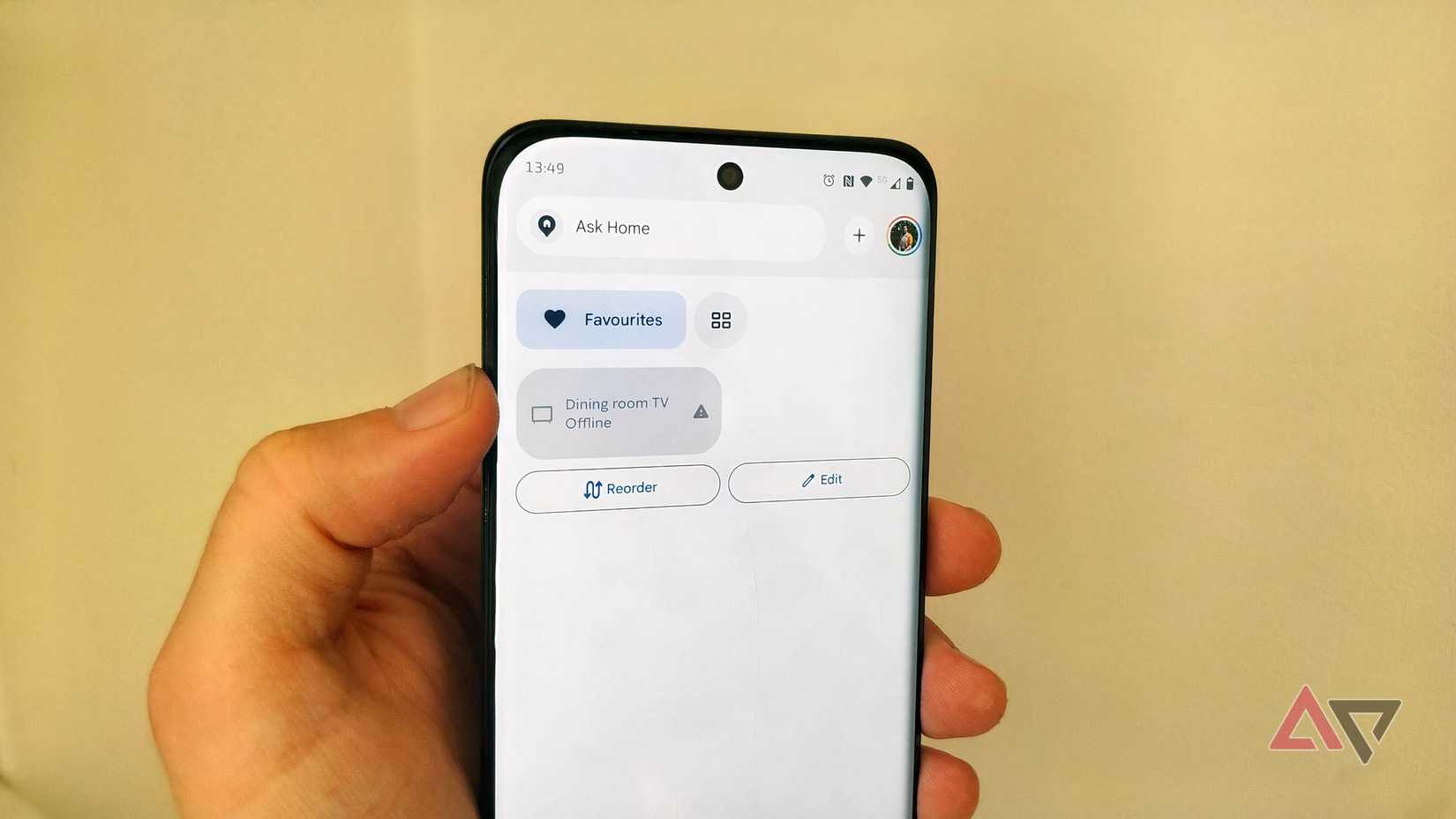 A Motorola phone showing a disconnected Dining room TV in Google Home.