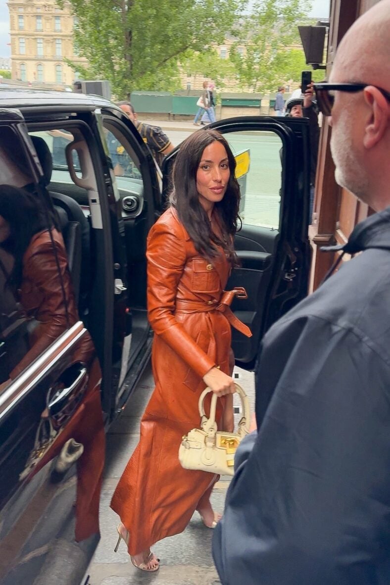 Ines de Ramon dressed in cognac leather trench dress