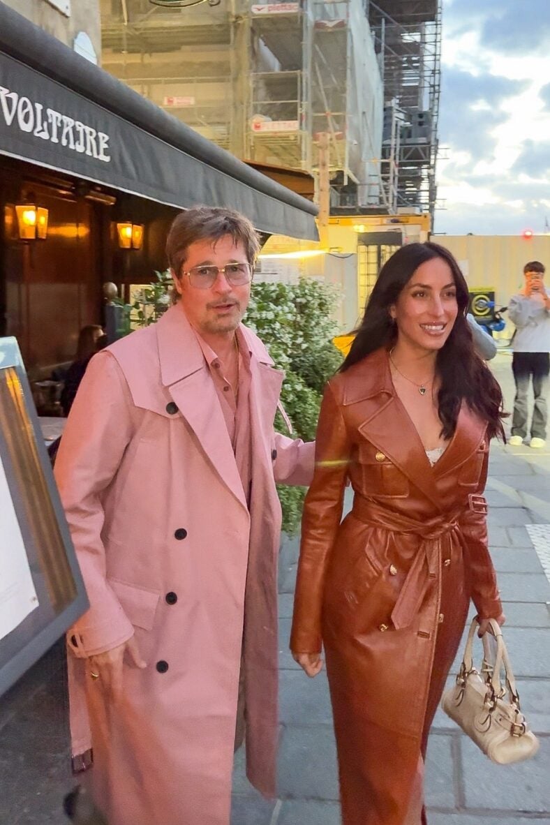 Brad Pitt wears pink trench coat to dinner in Paris with girlfriend Ines de Ramon dressed in cognac leather trench dress