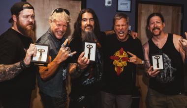 Members of Machine Head holding keys