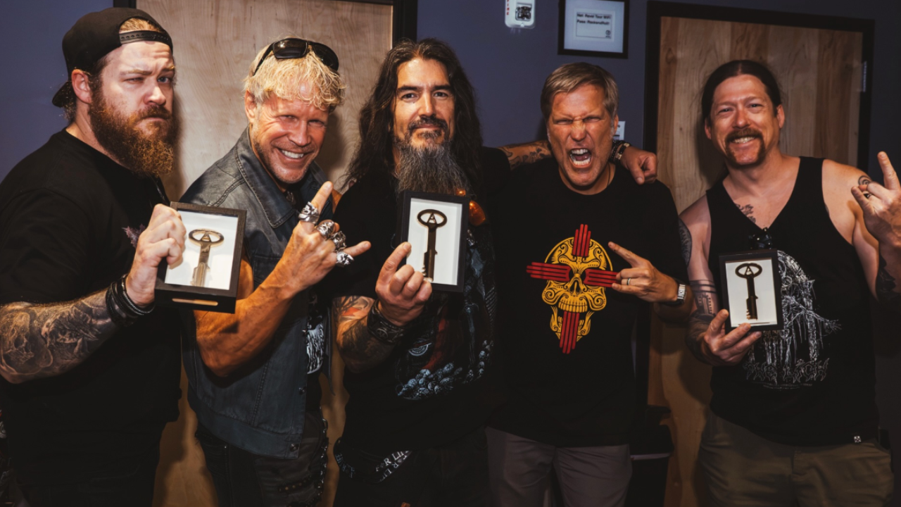 Members of Machine Head holding keys