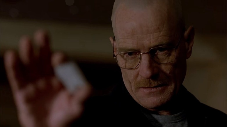 Bryan Cranston as Walter White holding a crystal in Breaking Bad