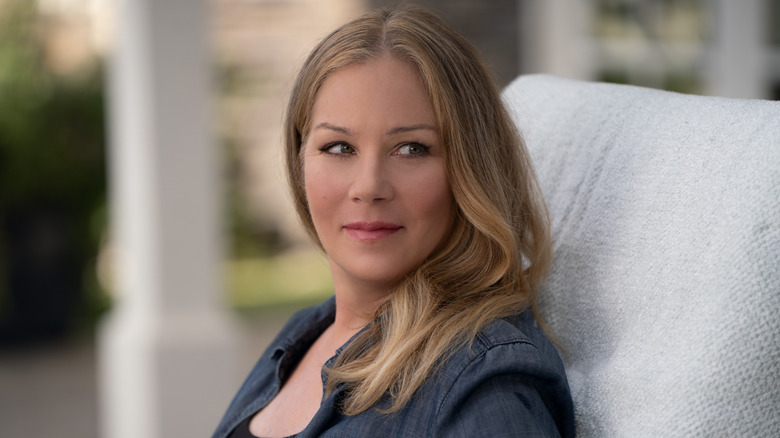 Jen smiling with head turned to the side