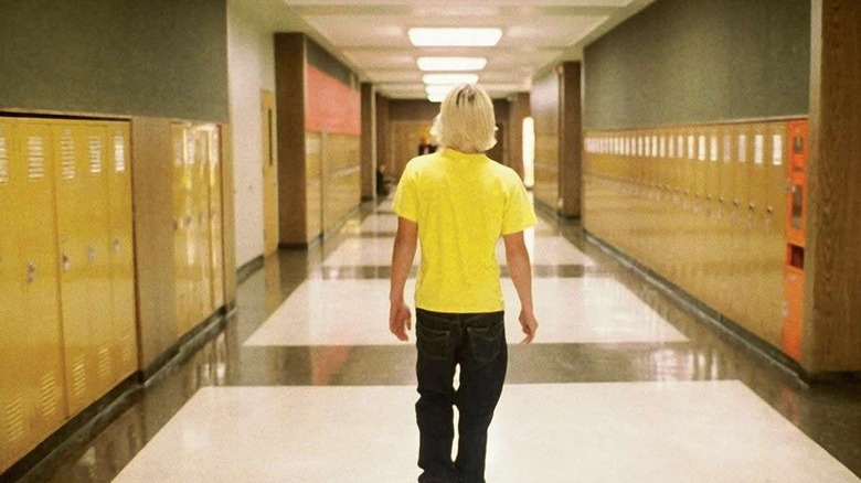 John walking down a hallway in Elephant